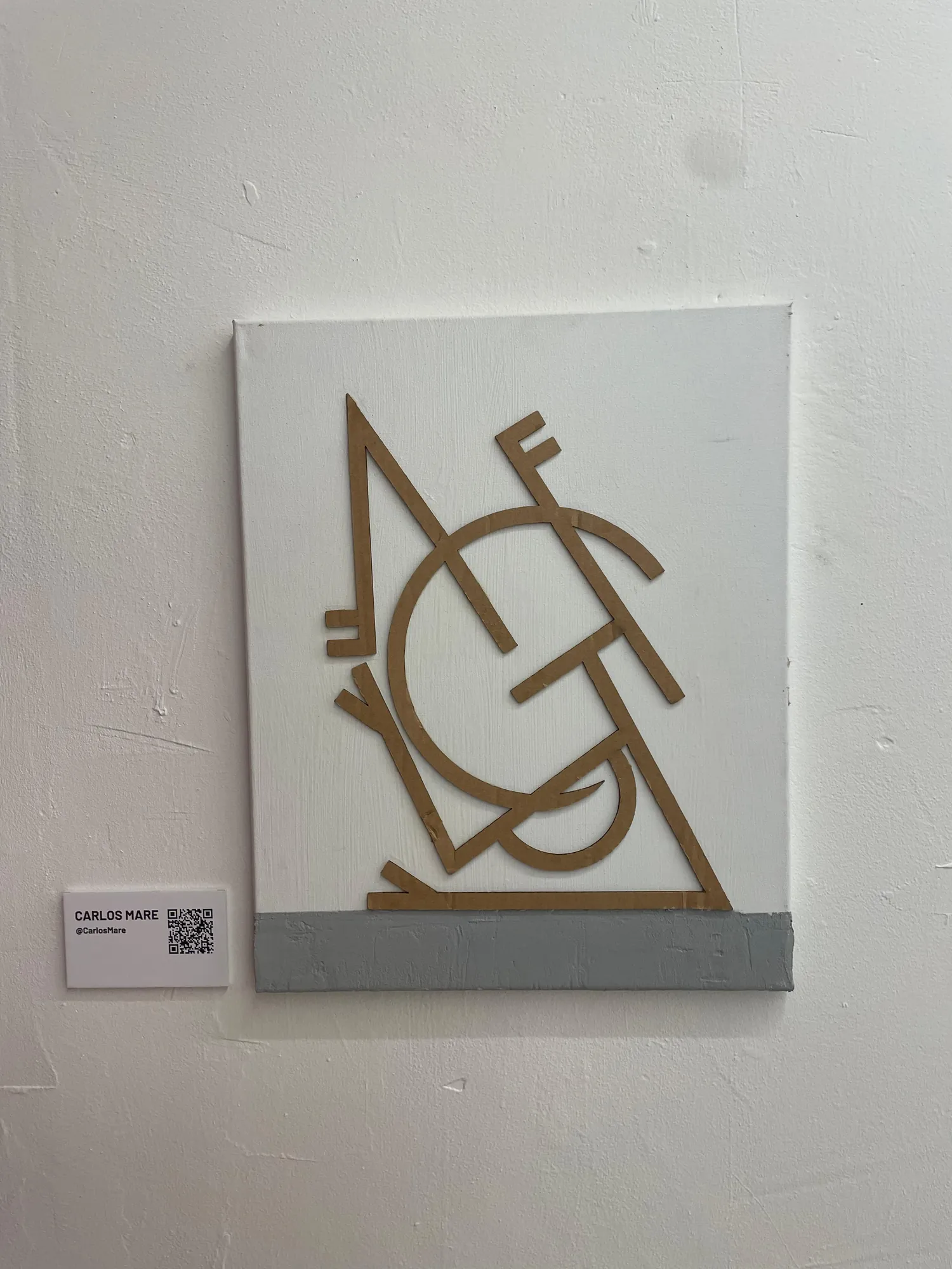 A framed graffiti piece on display