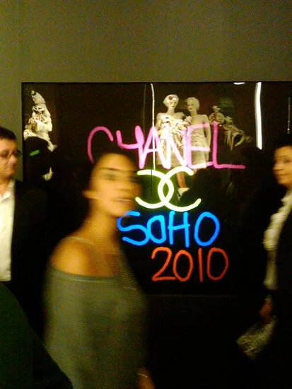 'CHANEL SoHo 2010' painted in bright colours with the double-C logo on the interactive graffiti wall at the flagship reopening