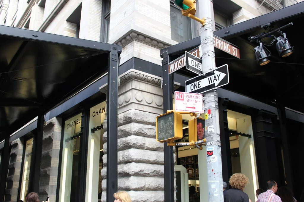 The Chanel SoHo flagship on the corner of Wooster and Spring Streets, black tents housing the interactive graffiti walls at the storefront, 2010