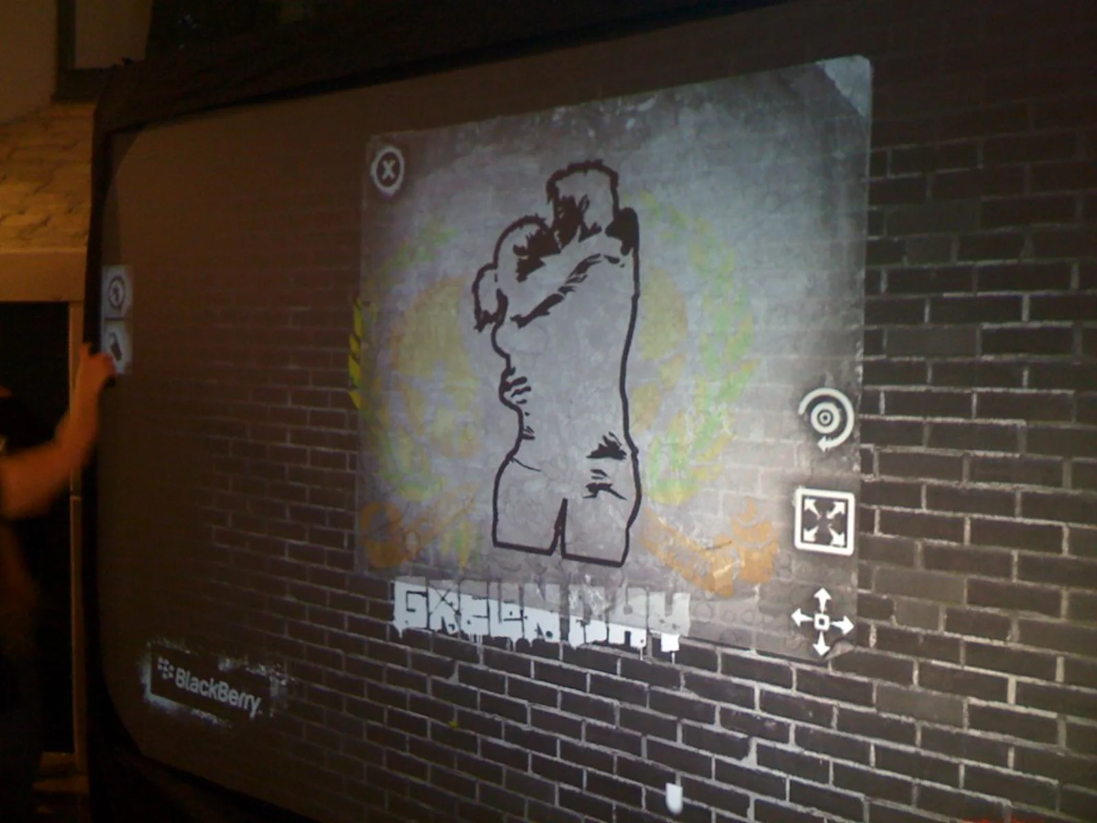 The 21st Century Breakdown album cover — a couple embracing, in stencil graffiti — recreated on the Graffiti+ digital wall