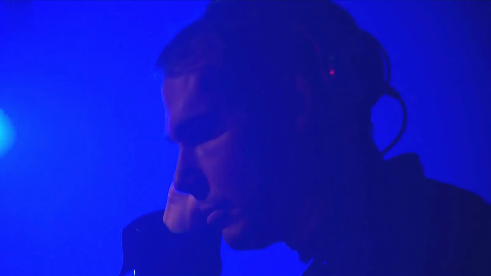 A DJ set under blue stage light at the Hennessy Very Special by Shepard Fairey launch, Tokyo 2015