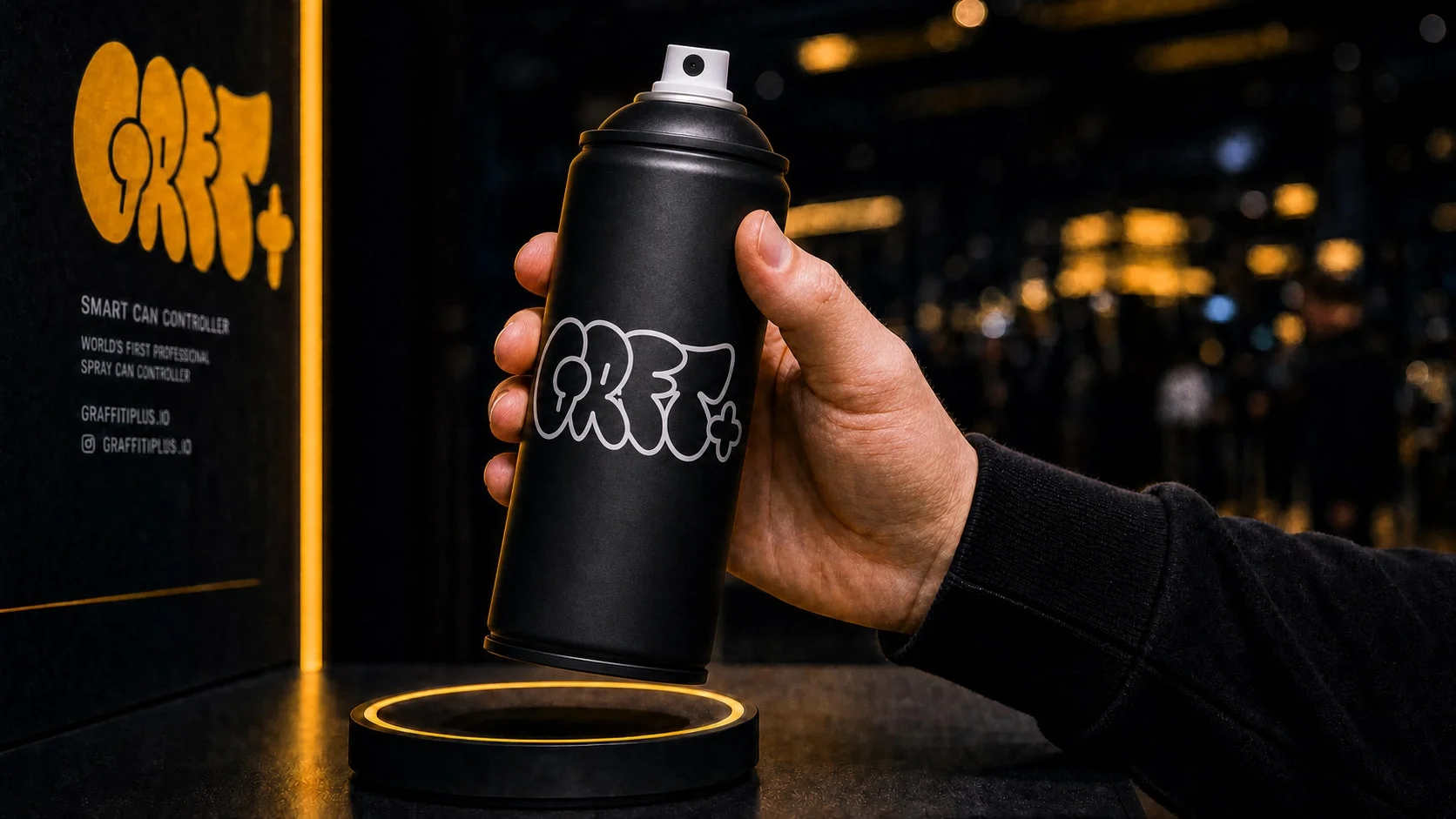 Event guest picking up a custom-branded digital spray can controller